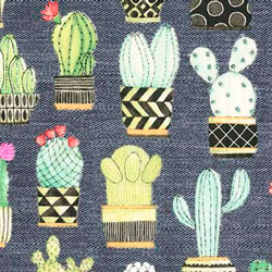 Preciosa tela con original estampado de cactus sobre fondo imitación vaquero. Tejido 100% algodón.